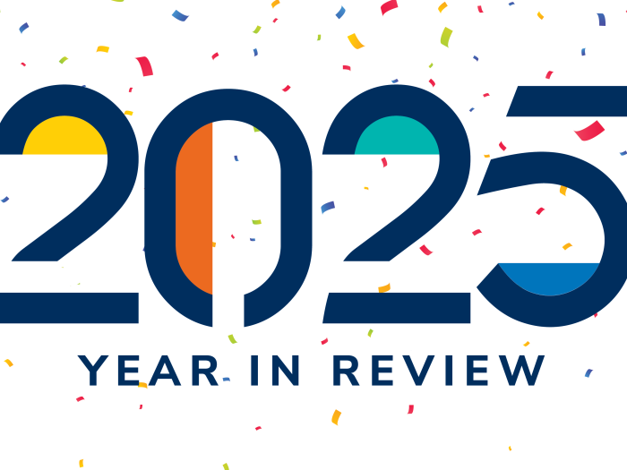 Colorful text reading "2025 Year in Review" displayed on a background of confetti