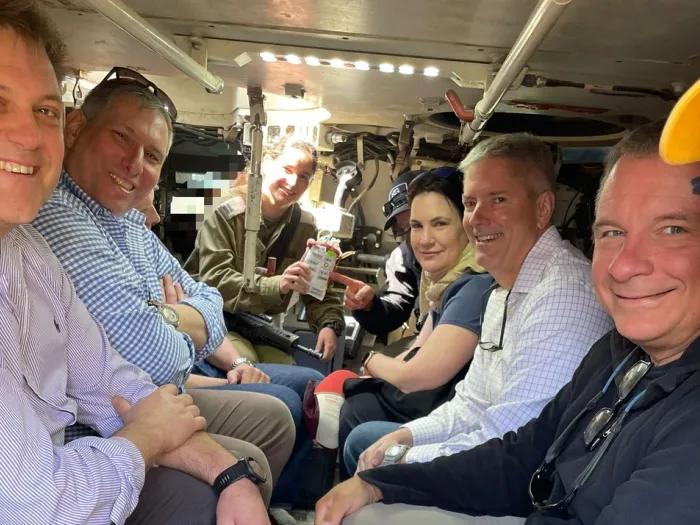 Dr. Kevin Ward and members of THOR aboard an armored personnel carrier.