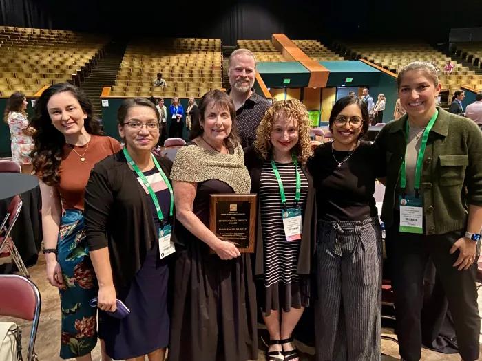 Former graduates of the C/L Psychiatry Fellowship, with the first program director Dr. Riba, at ACLP Annual Meeting 2024.  Tiffany Prout, MD, Kamalika Roy, MD, Michelle Riba, MD, Scott Winder MD, Amy Rosinski MD, Shivali Patel, MD, Shami Entenman MD.  