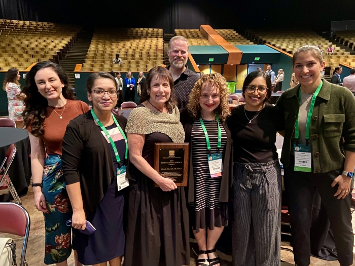 Former graduates of the C/L Psychiatry Fellowship, with the first program director Dr. Riba, at ACLP Annual Meeting 2024.  Tiffany Prout, MD, Kamalika Roy, MD, Michelle Riba, MD, Scott Winder MD, Amy Rosinski MD, Shivali Patel, MD, Shami Entenman MD.  