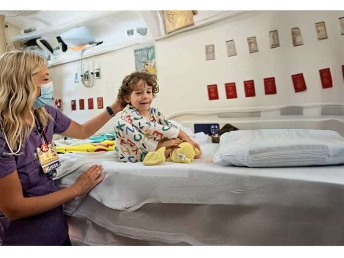 Olivia Goff nurses a pediatric patient in Mott Hospital