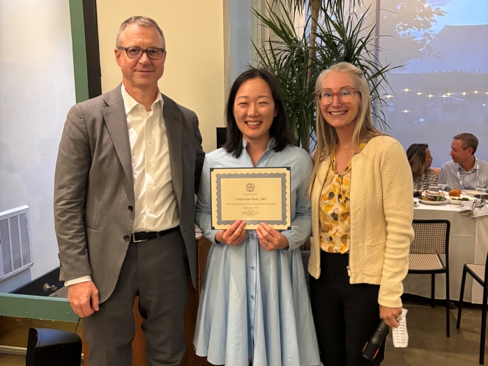 Picture Dr. Cathy Nam accepting award from Dr. Mary Samplaski, the incoming president of the Society for the Study of Male Reproduction (SSMR) and Dr. Bob Brannigan, Fellowship Director at Northwestern