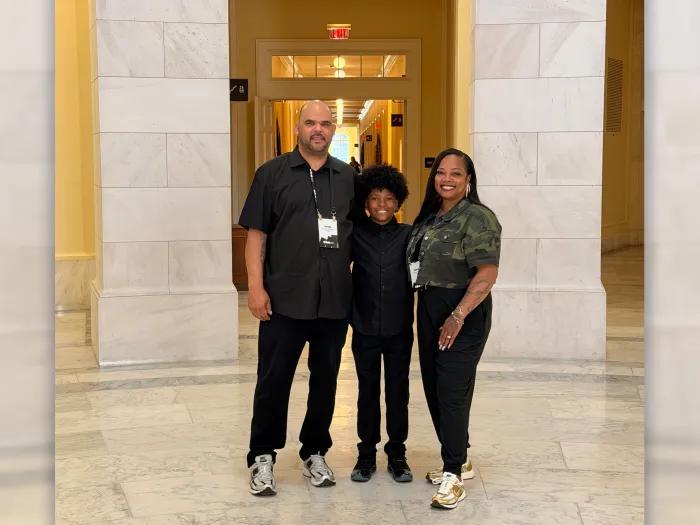 family smiling inside capitol