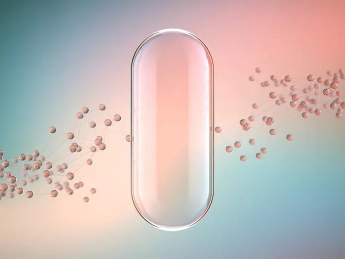 clear see through pill floating with other little pills behind in blue teal pink background