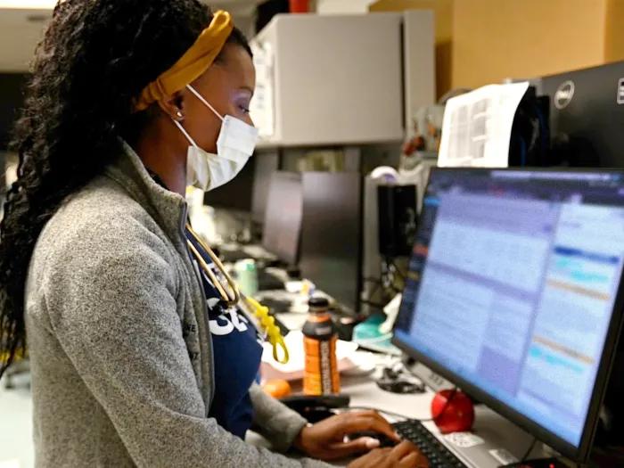 woman looking at screen in office clinical area