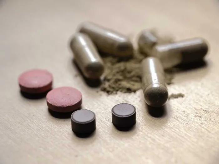 pills close up some powder some round some long