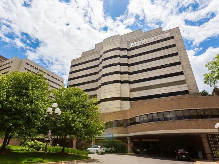 Rogel Cancer Center with trees and blue sky