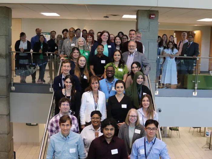 a group photo on a staircase