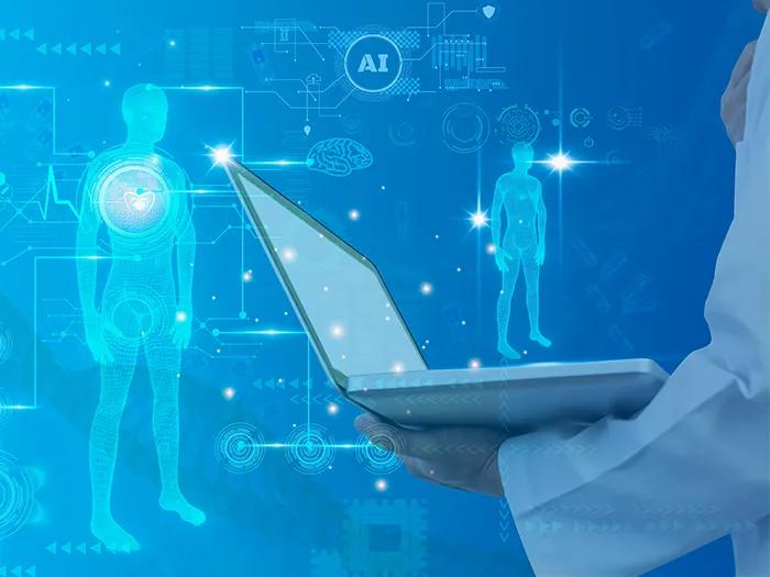 futuristic image of human outline with doctor holding laptop
