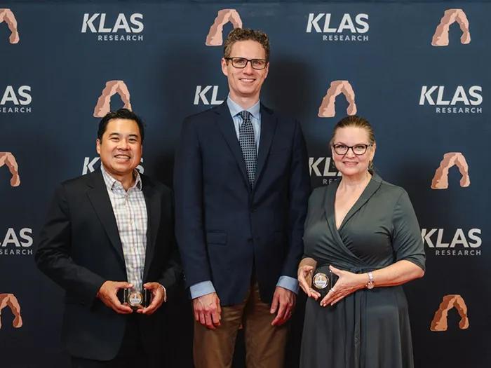 Doctors Rino Bautista, Michael Lanham, and Greta Branford accepting awards at KLAS summit