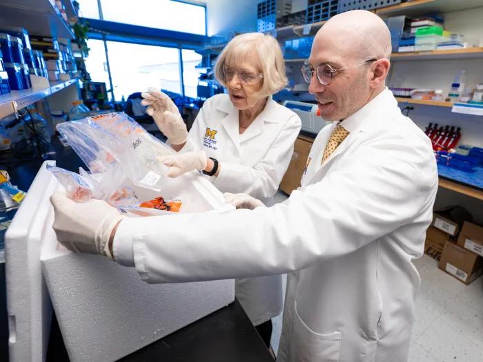 Drs. Eva L. Feldman and Stephen Goutman handling samples in the lab