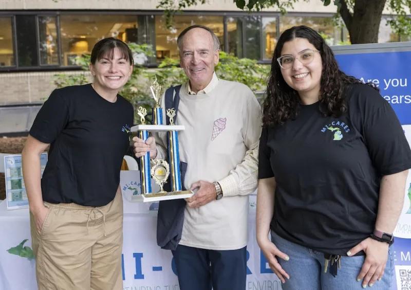 The MI-CARES team accept the Spirit Award from Dr. Kunkel