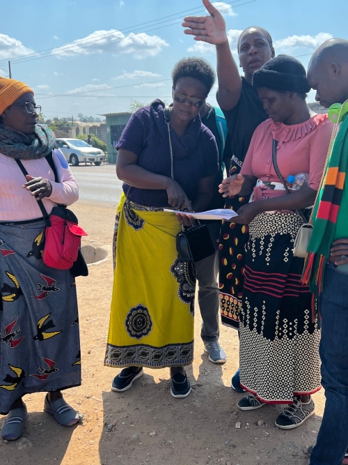 Z-CHAD community healthcare workers going over the maps of their study sites