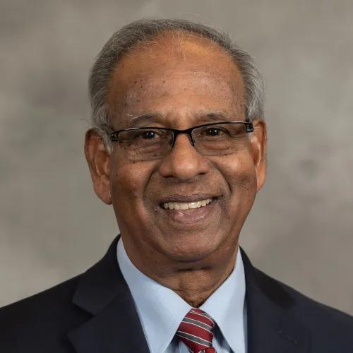 headshot of K.M. Jairam Menon