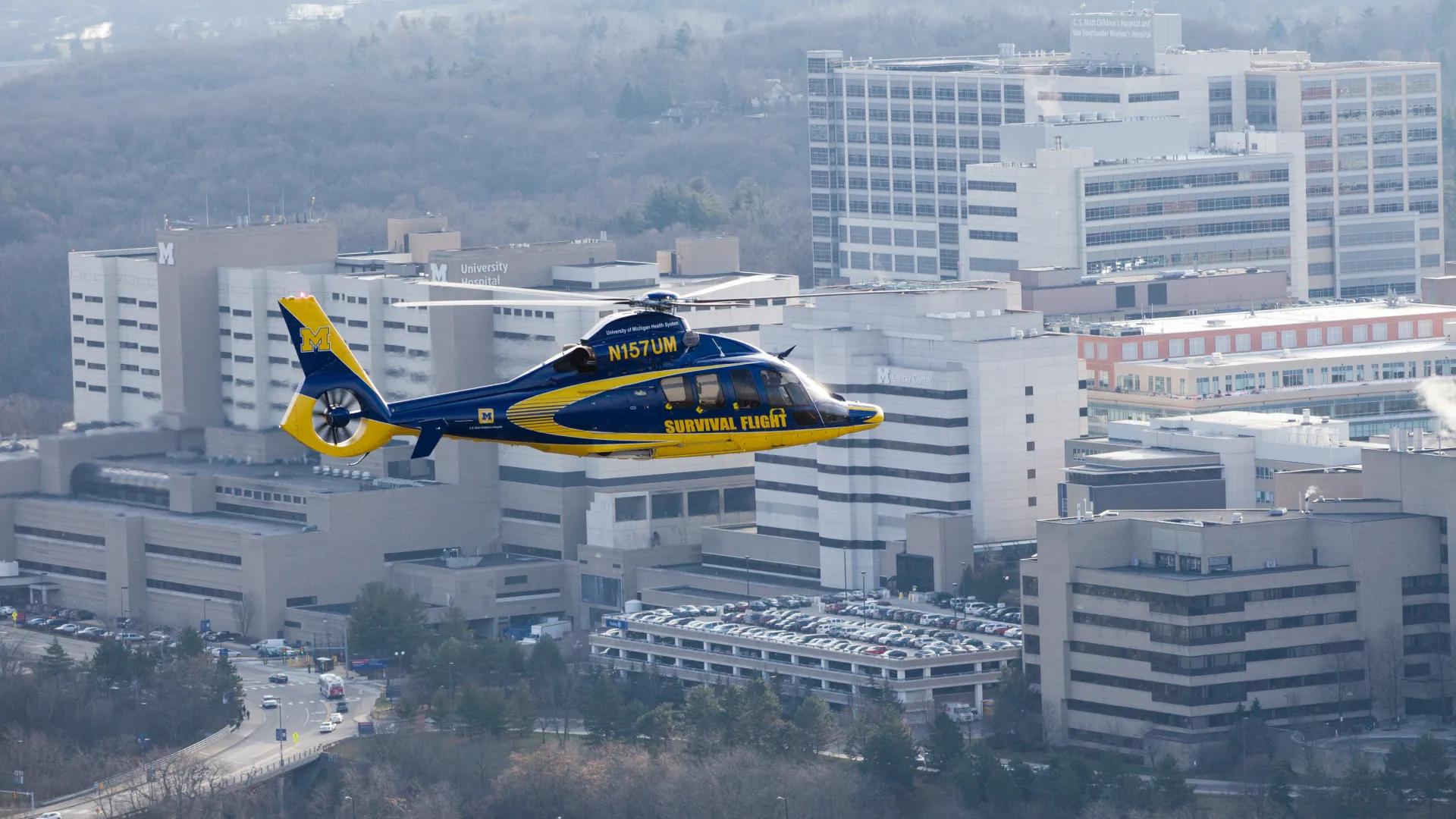 A survival flight helicopter flies near the hospital