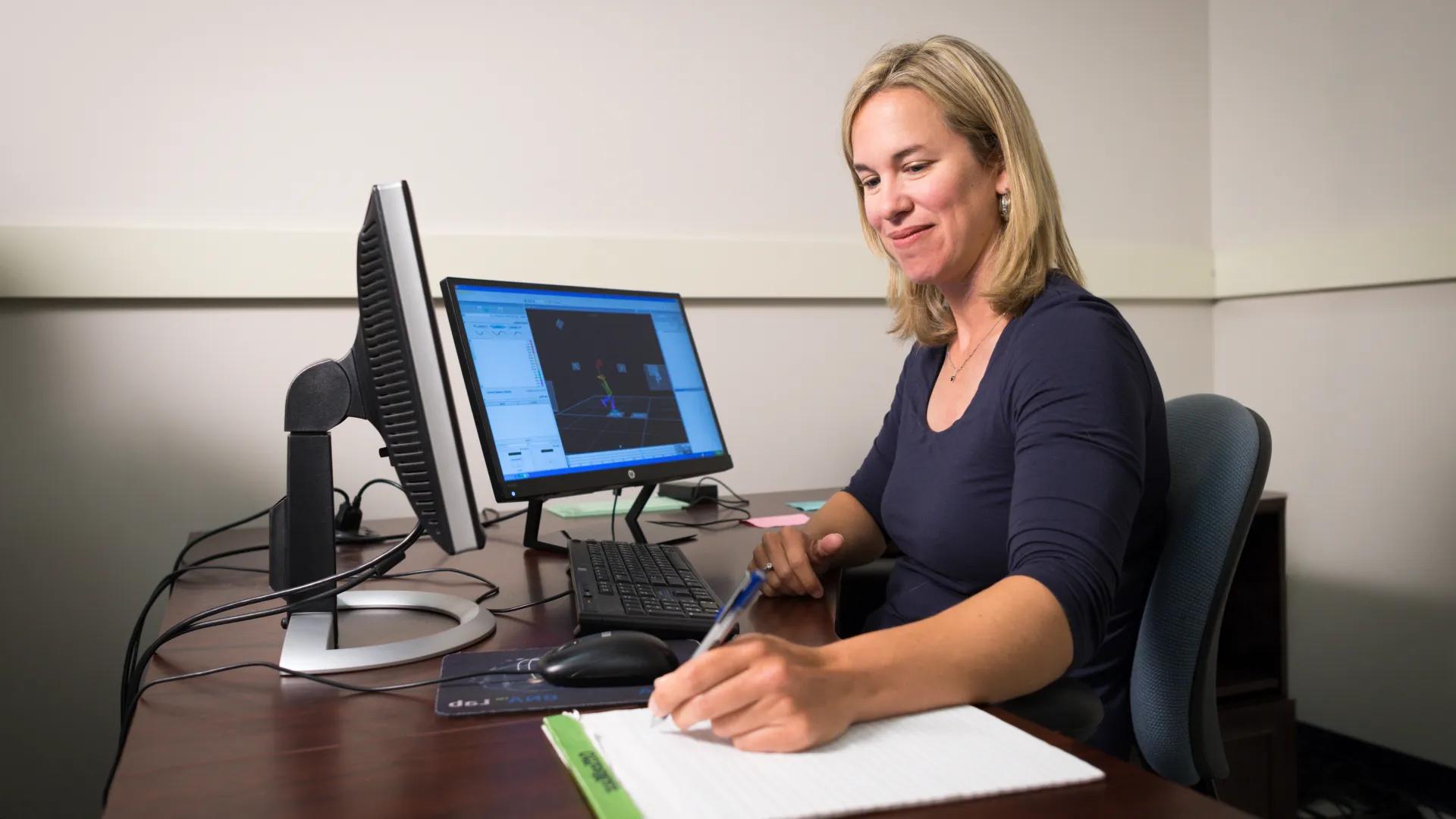 researcher working at a computer