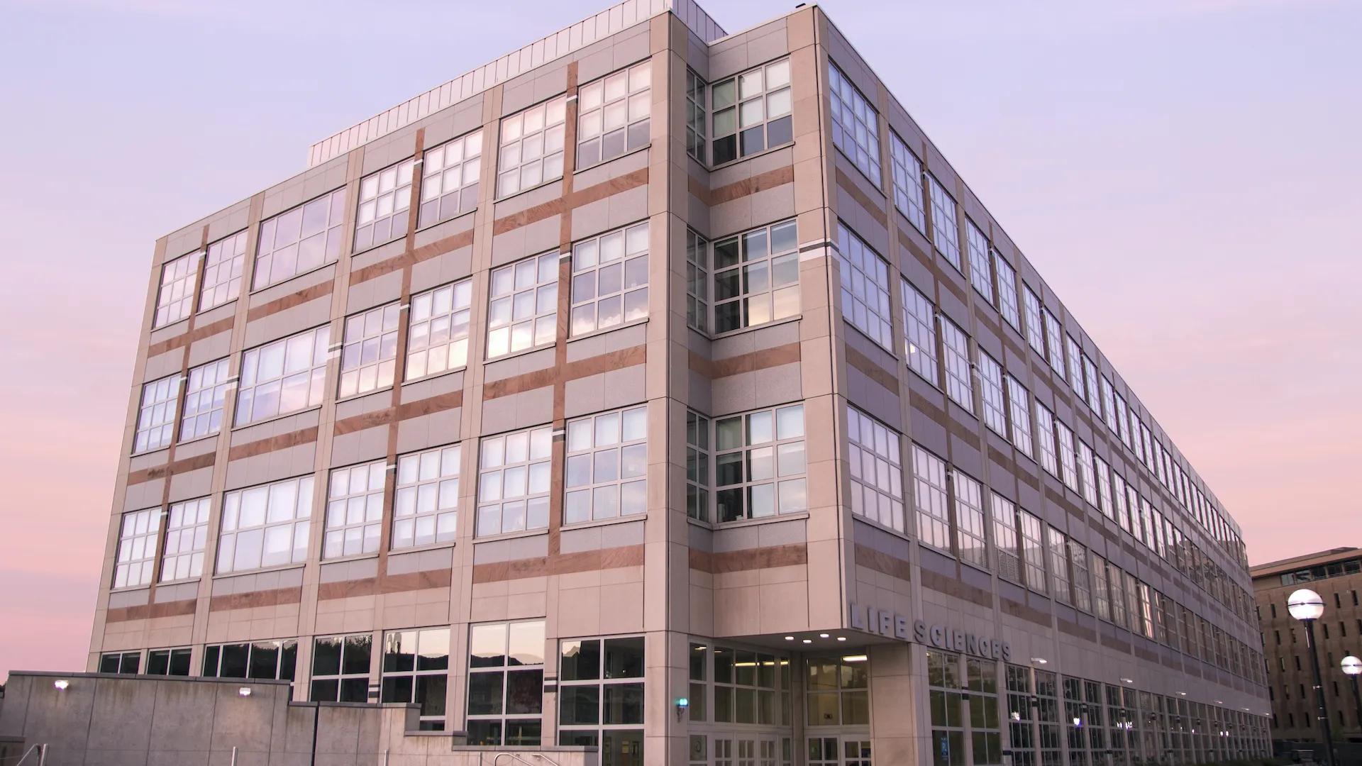 life sciences institute building at dusk with sunset in background 