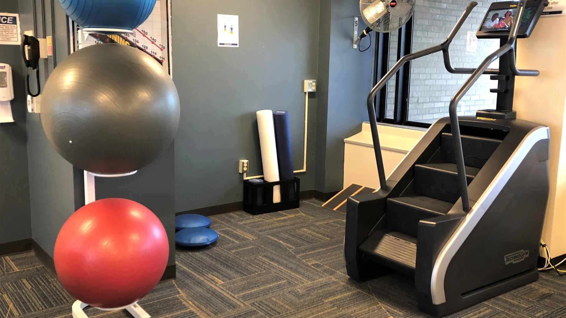 stair stepper and rubber balls in common area of wellness center