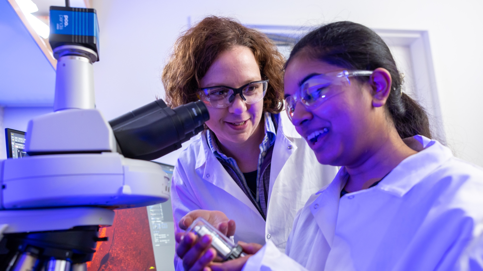 Researcher in Mattis lab looking at lab tools 