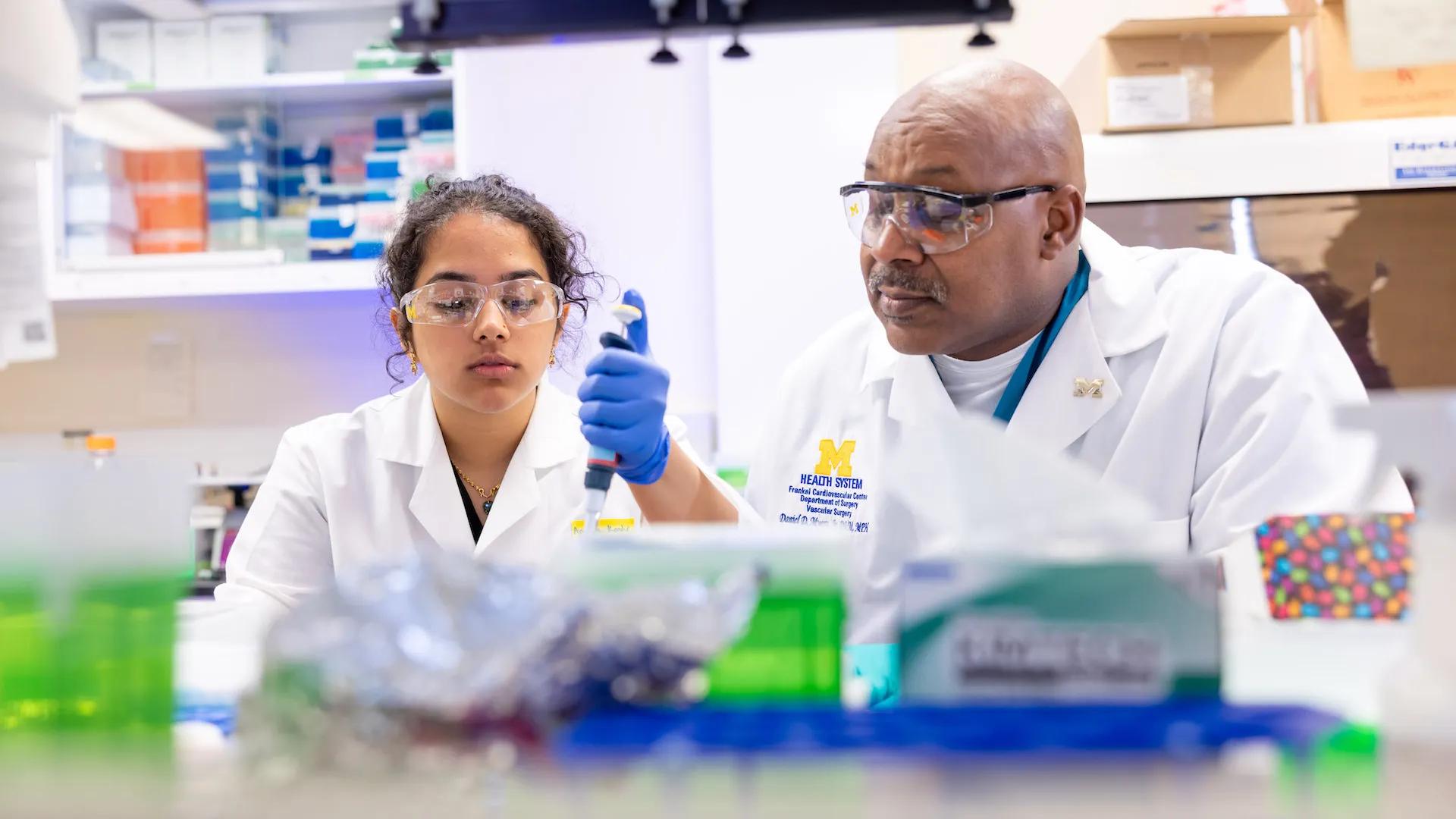 Dr. Myers in his lab with one of his team members