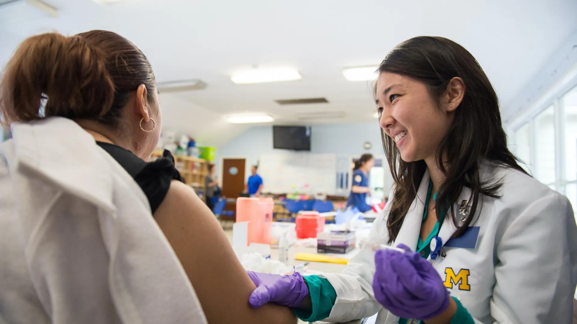 Photo of a female u-m faculty with female patient