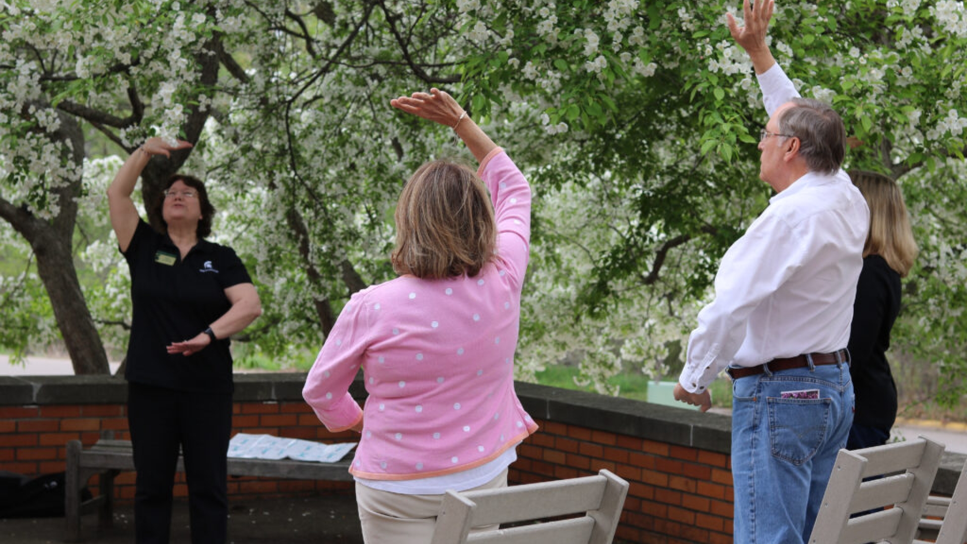 Caregivers practicing tai chi at the Caregiver Wellness Day retreat. 