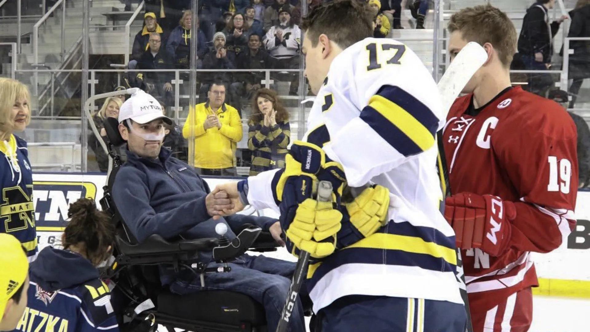 Scott Matzka dropping the puck at the IceALS game 