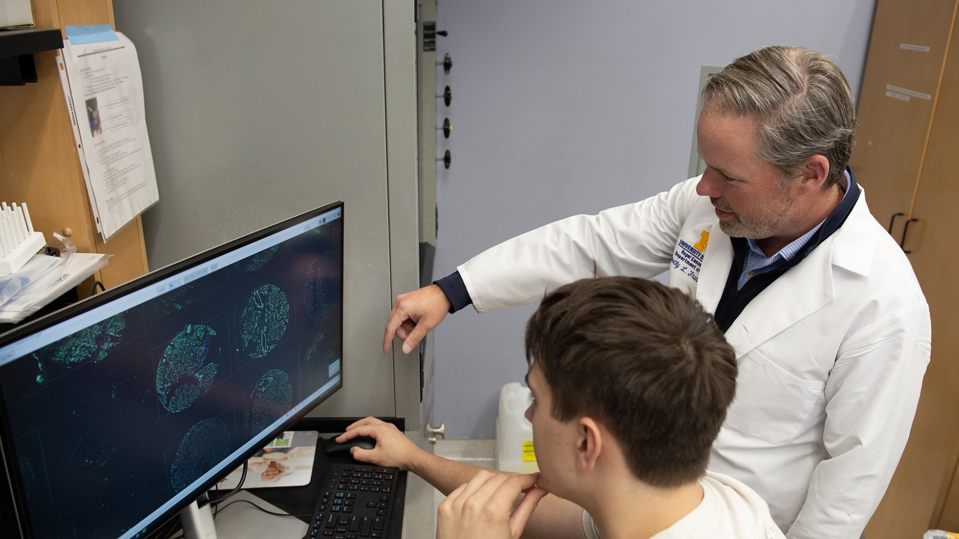 Dr. Frankel and lab member looking at a computer