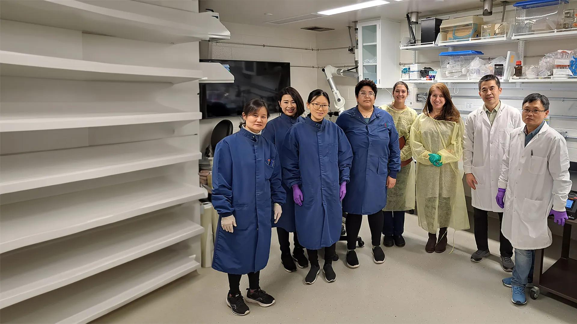 personnel posing for a photo in the mmpc-live lab