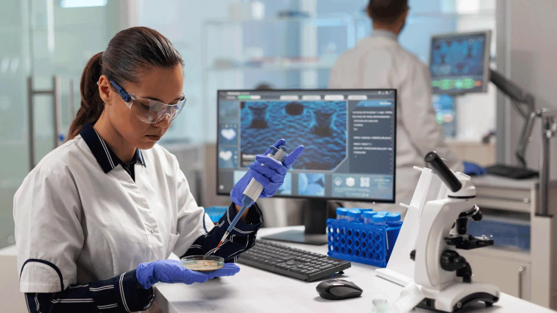 Person Pipetting into Petri dish