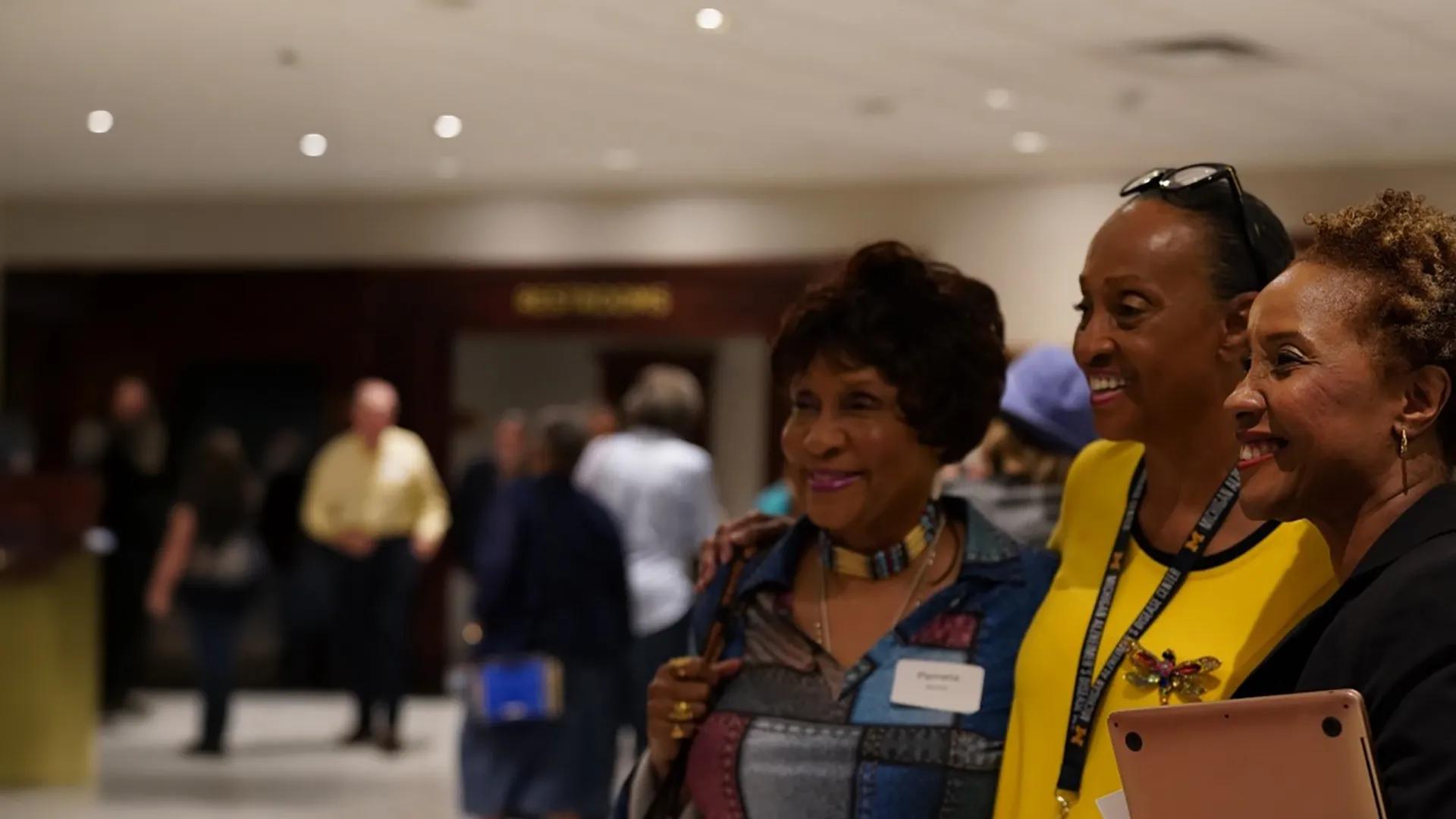 three woman at an event