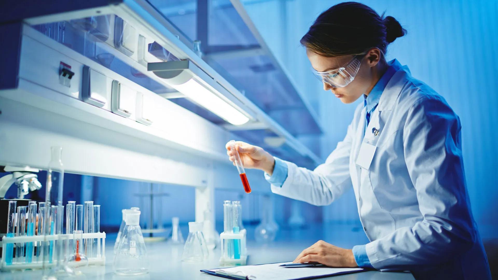 Female scientist holding test tube