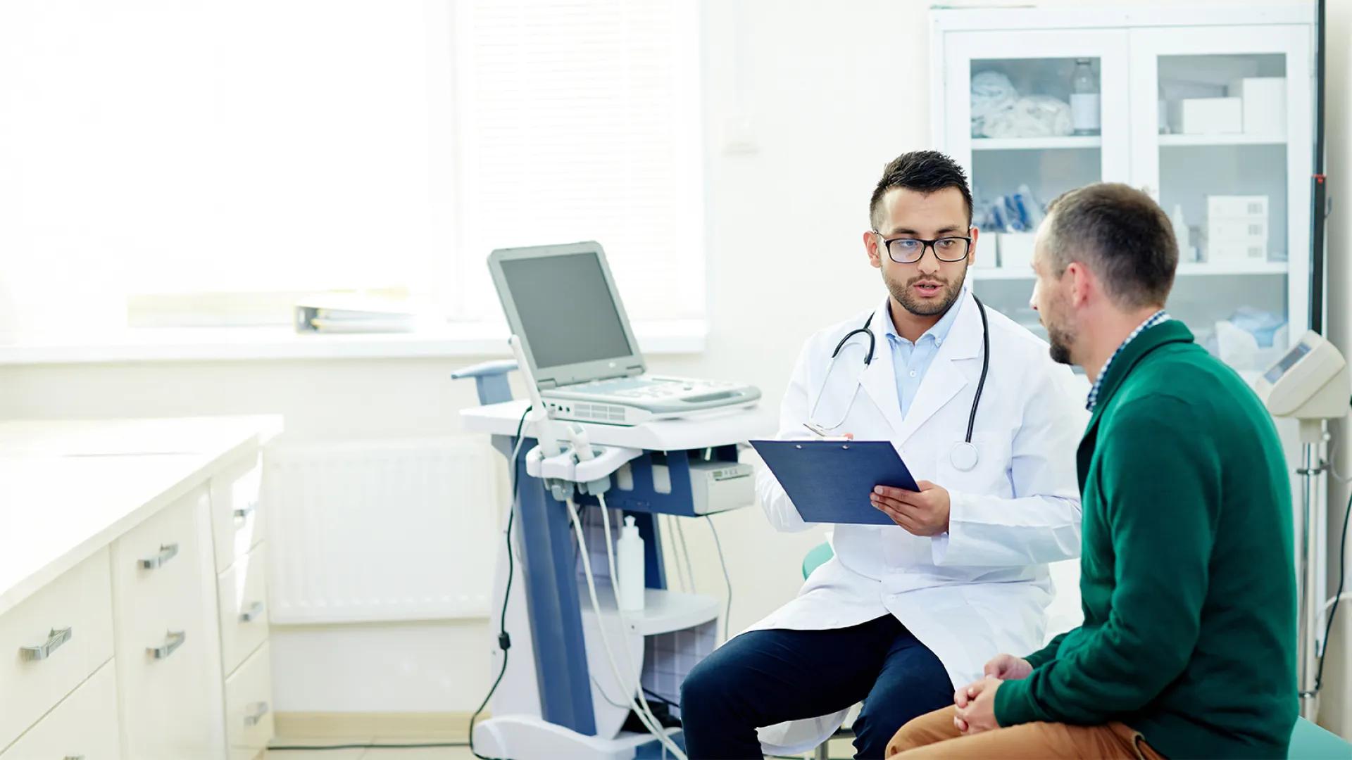 doctor and patient speaking in a clinical room