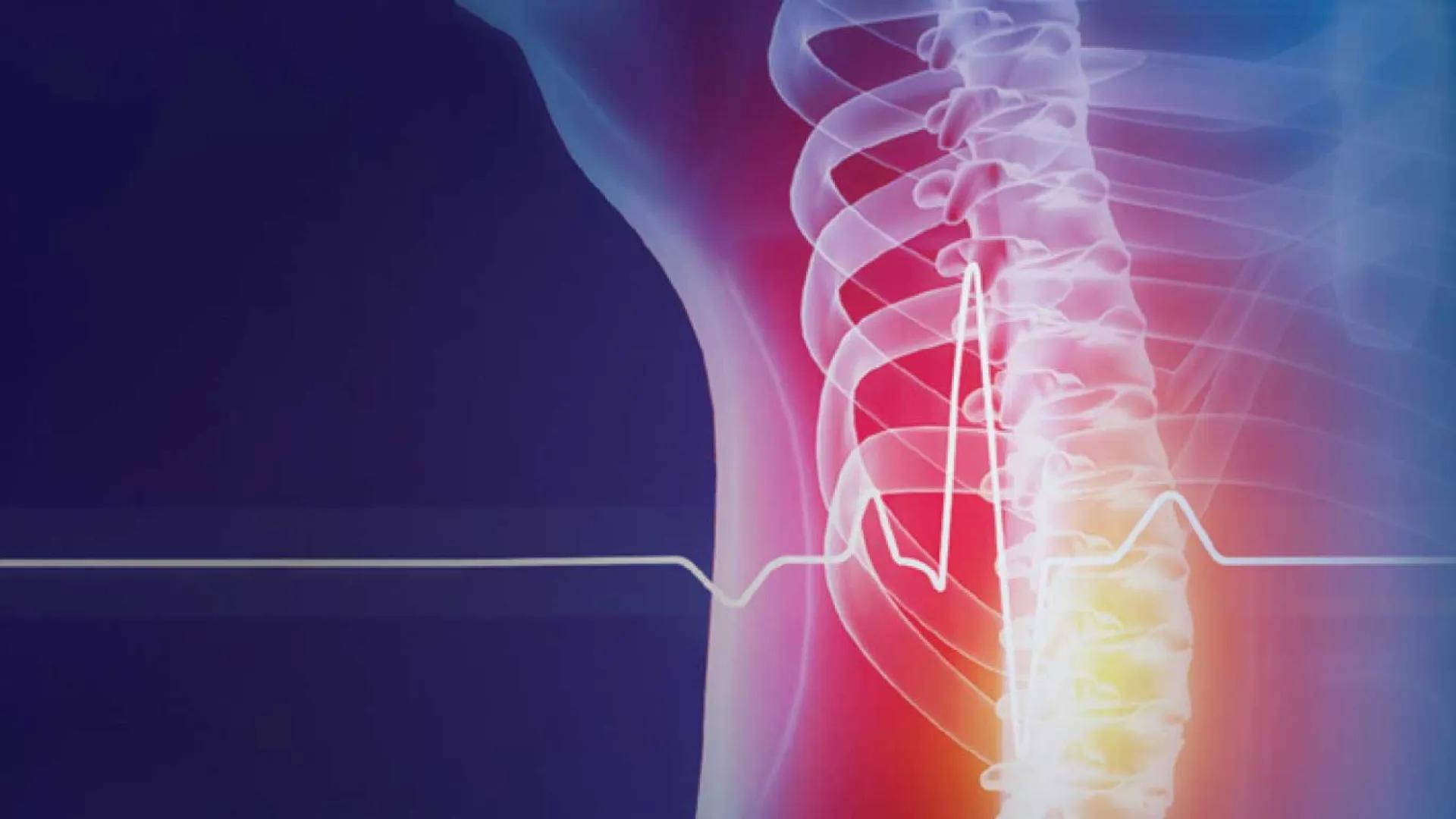 Illustration of a human spine with a glowing overlay, highlighting the cervical and lumbar regions in red and yellow; a stylized heartbeat line runs across the image on a gradient blue background.