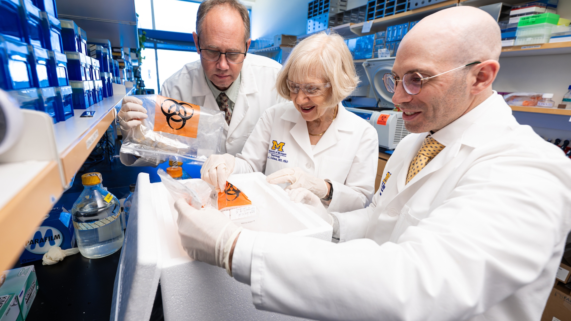 Drs. Ben Murdock, Eva Feldman and Stephen Goutman looking at samples in the lab