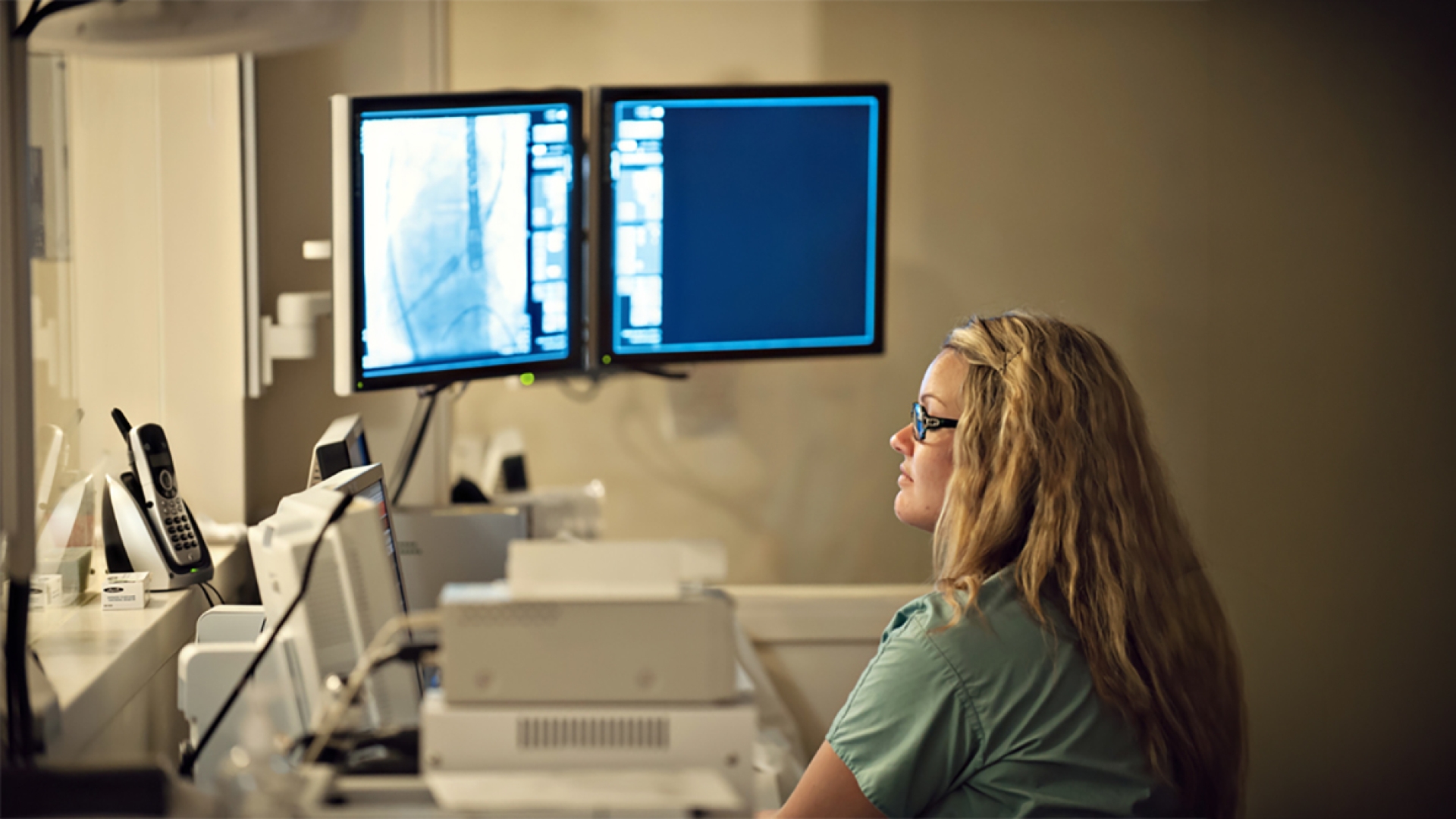 woman working in a lab with computers