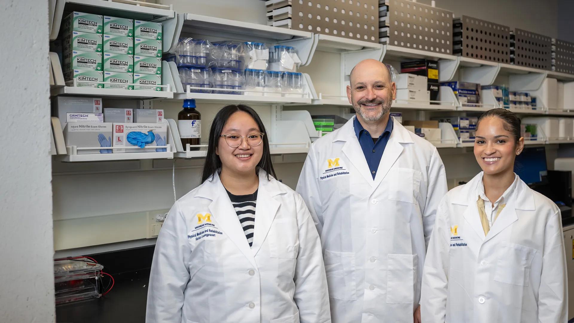 group of researchers posing for a photo in a lab