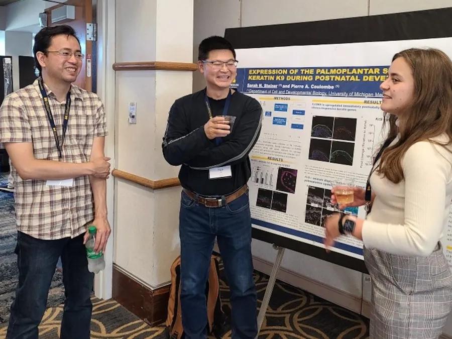 cell and developmental biology students talking in the hallway 