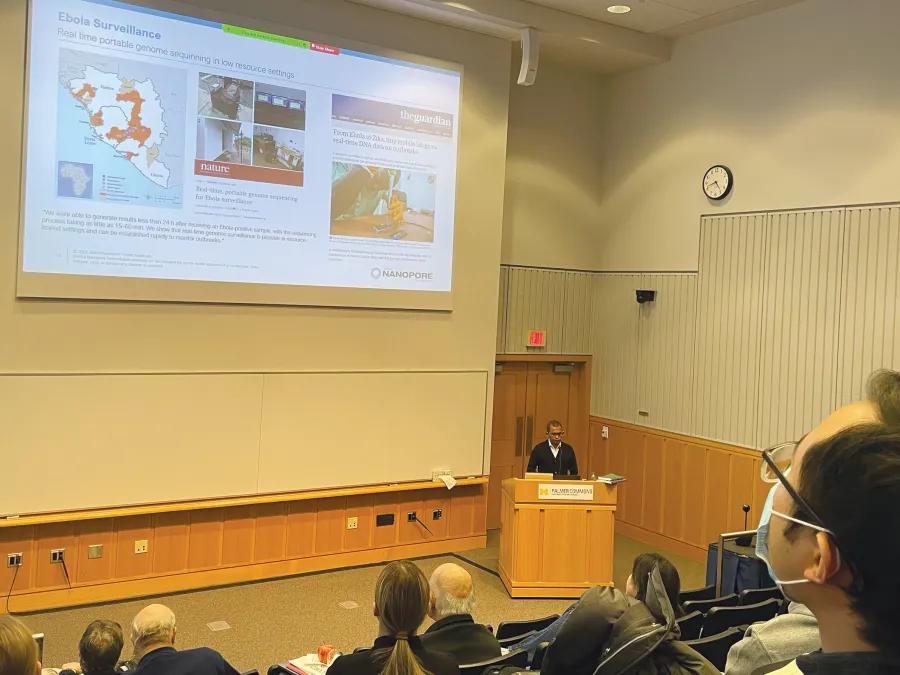 Students look a slideshow during a CCMB seminar