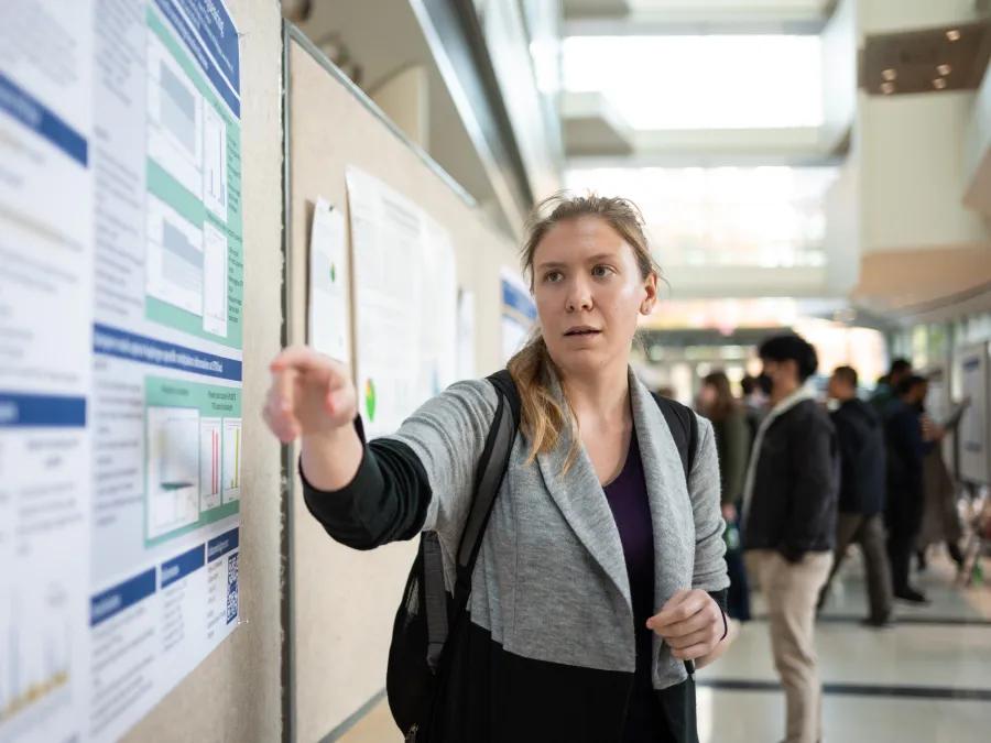 girl explaining a poster