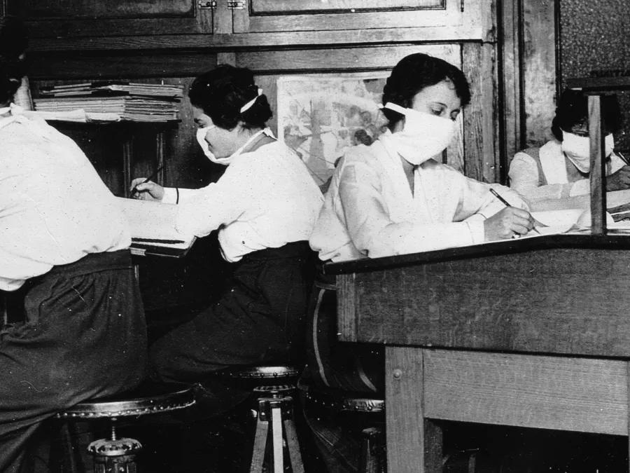 A group of administrators working at desks