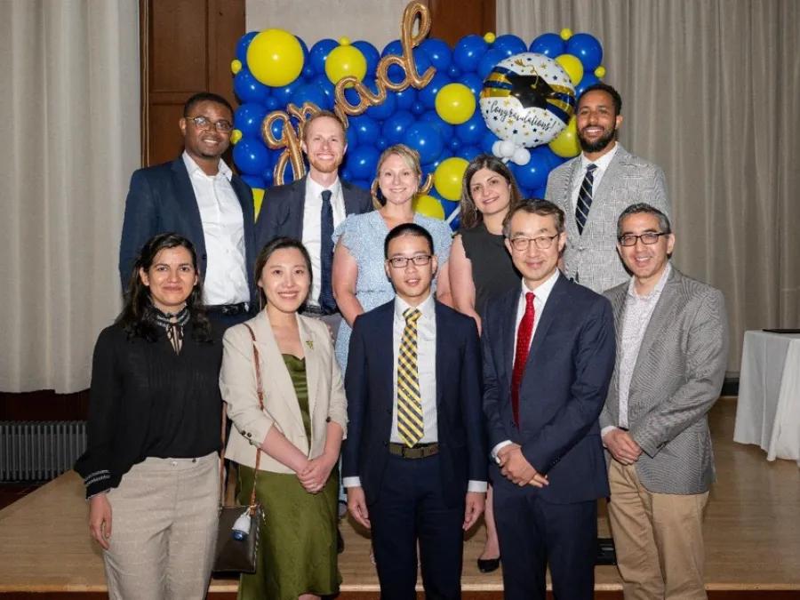group of radiation oncology residents smiling and looking at the camera