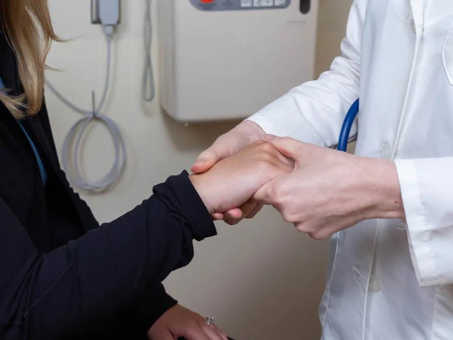 Doctor with patient in clinic