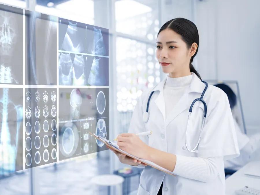 Female doctor evaluating screens