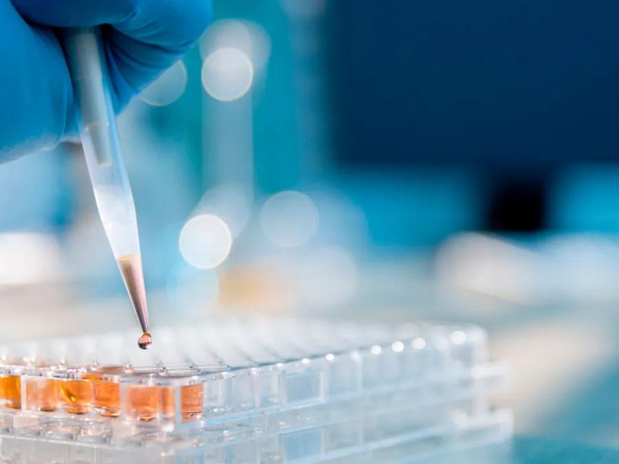 Scientist pipetting