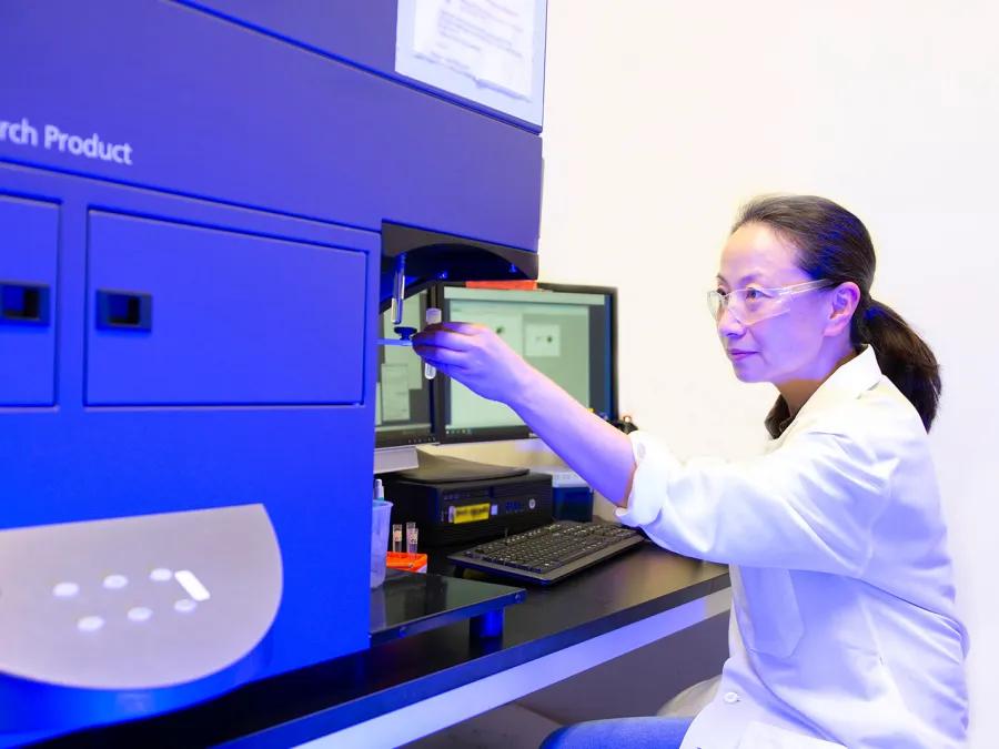 Lab member working with equipment in the lab