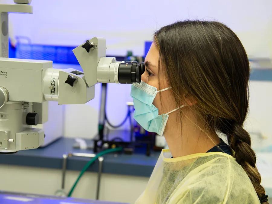 Lab member working with equipment in the lab