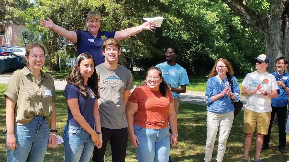 Students smiling outside at September 2023 picnic