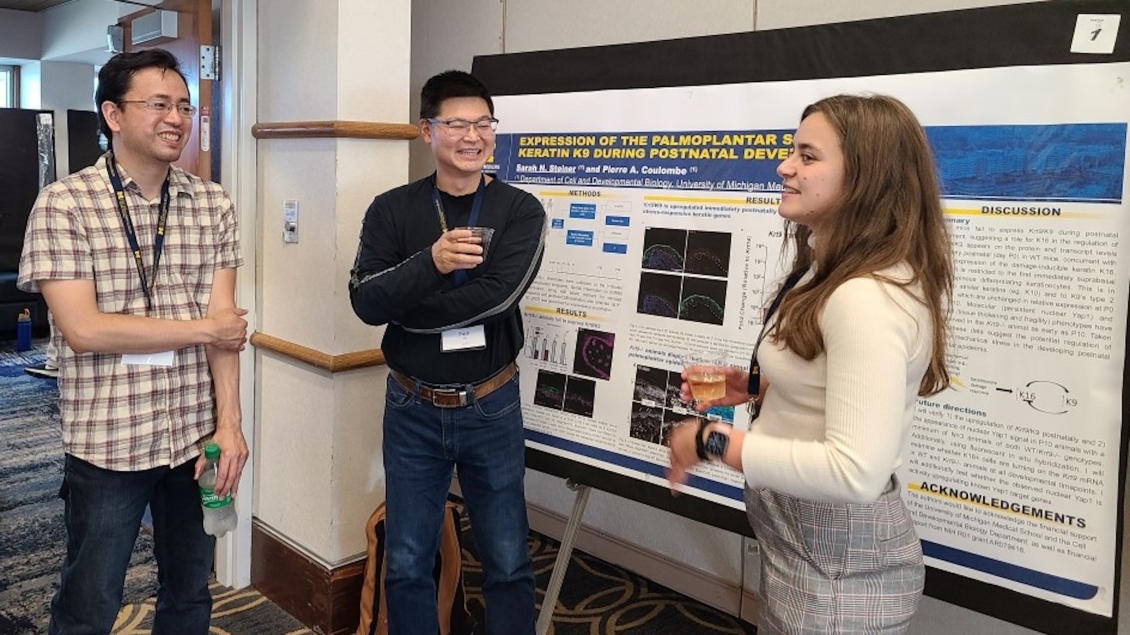 cell and developmental biology students talking in the hallway 