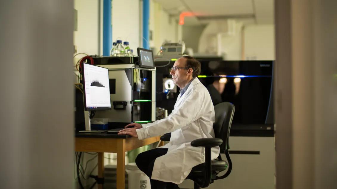 scientist using mass spectrometry technology